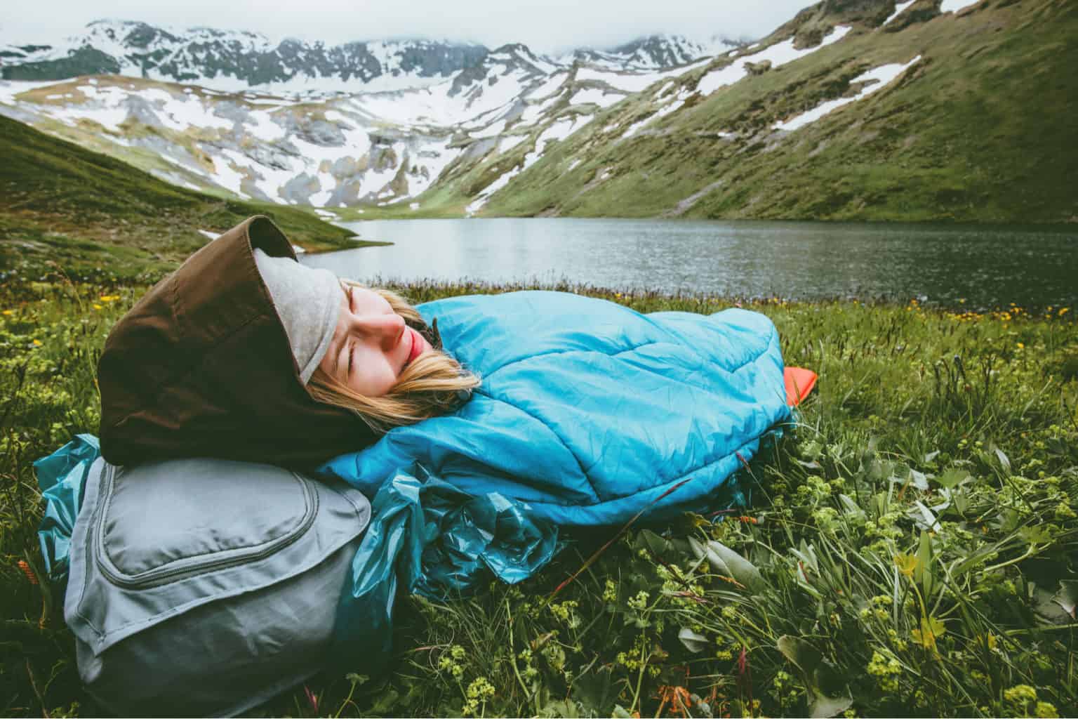 Woman relaxing in sleeping bag