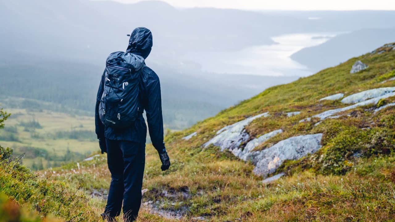 Hiker standing in a rain jacket