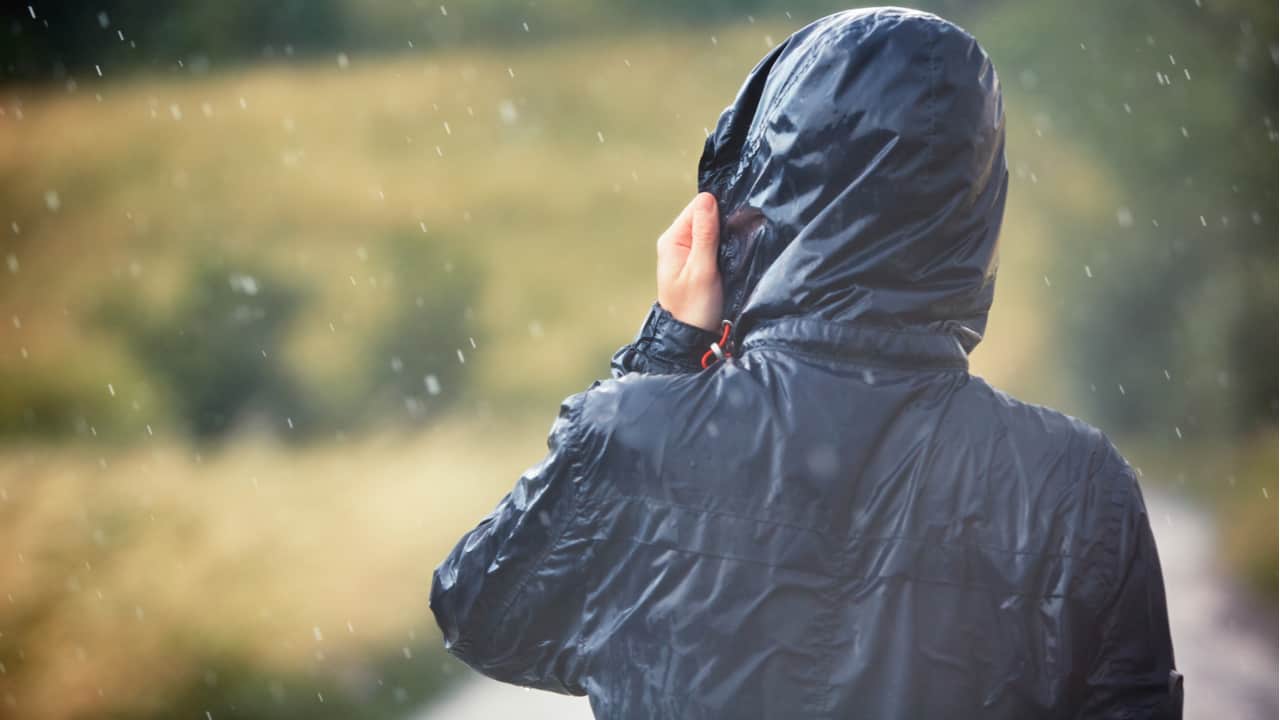 Hiker wears lightweight jacket in rain