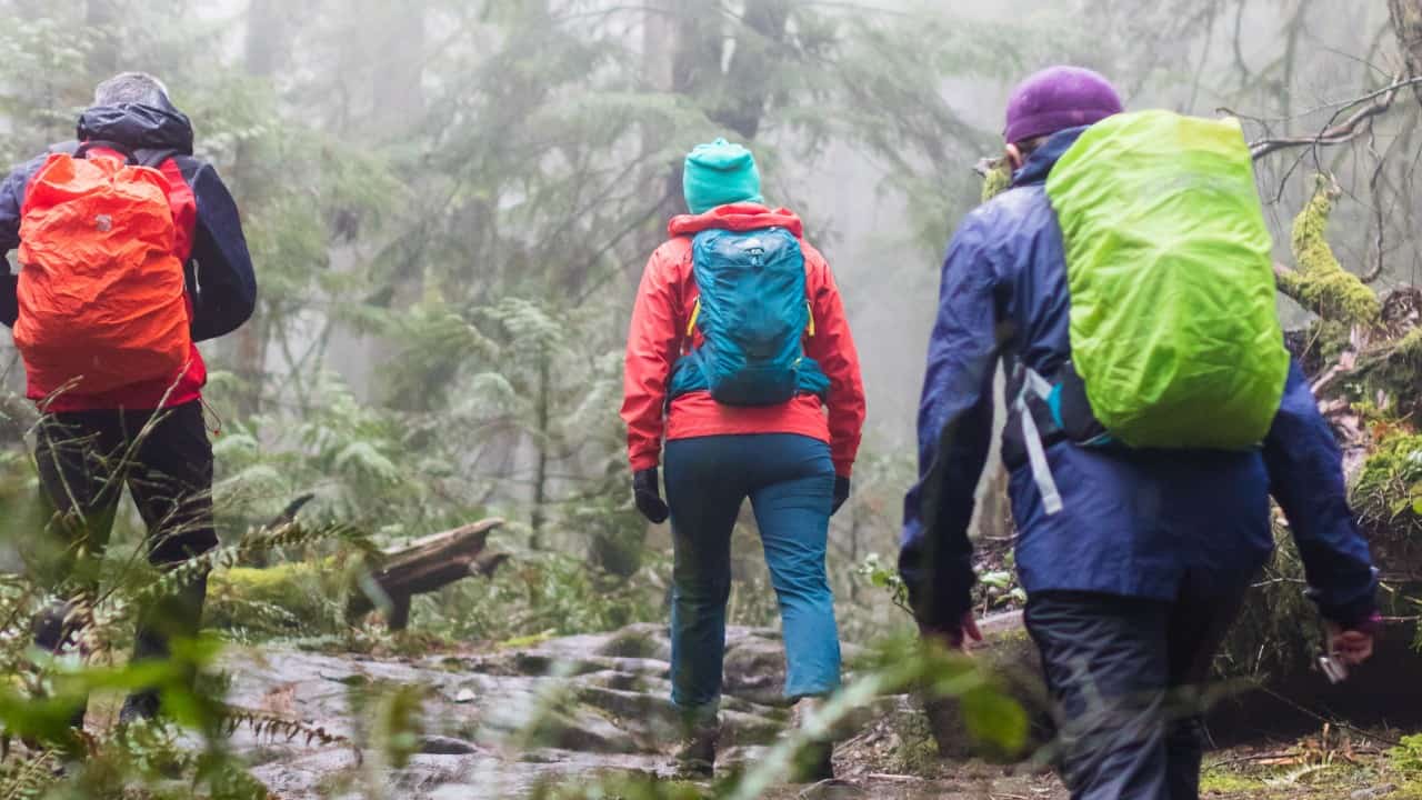 Hikers in lightweight rain jackets