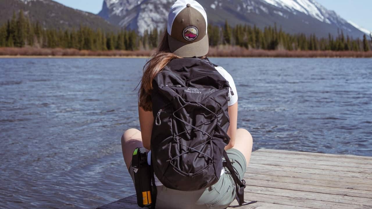 Woman sitting with a Gregory Backpack