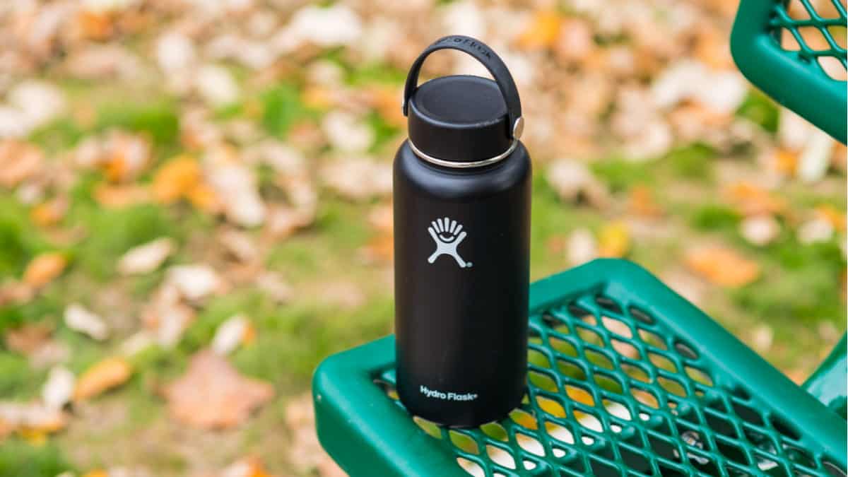 Black Hydro Flask sits on bench