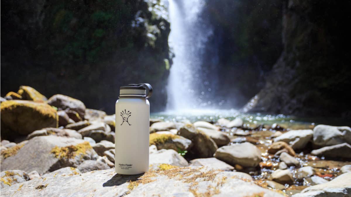 Hydro Flask in front of a waterfall