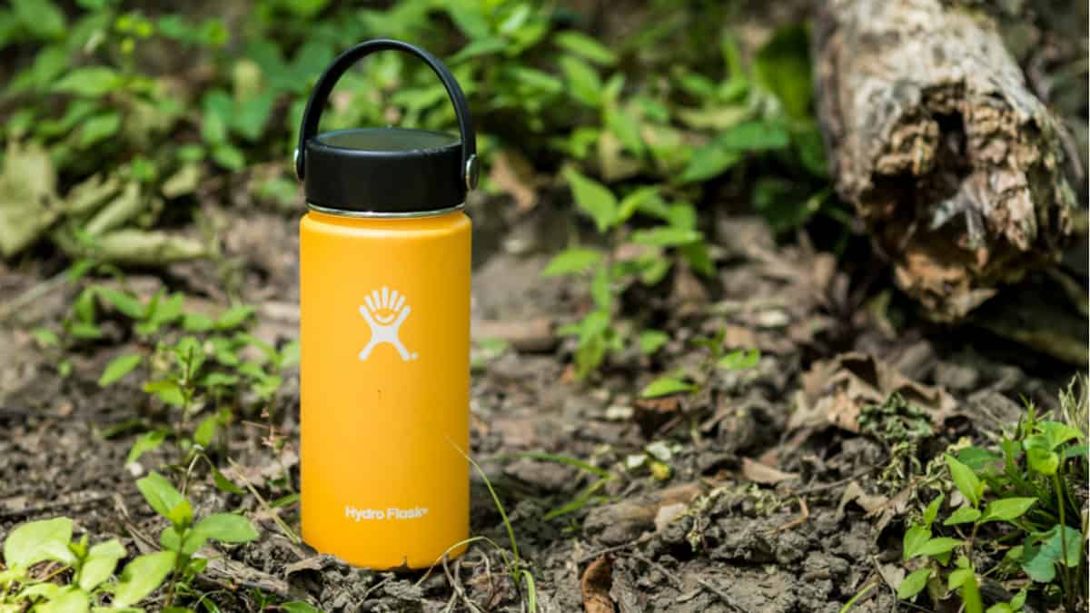 Yellow Hydro Flask in the woods