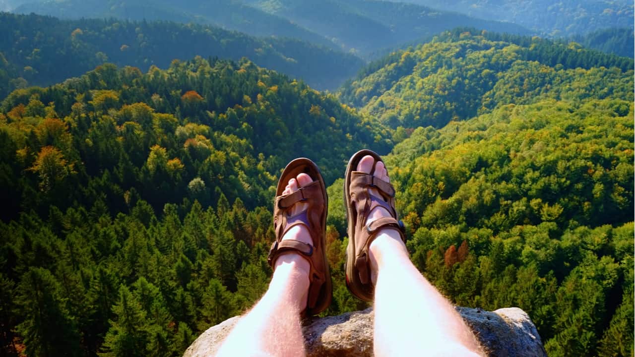 Hiking sandals on a hilly backdrop
