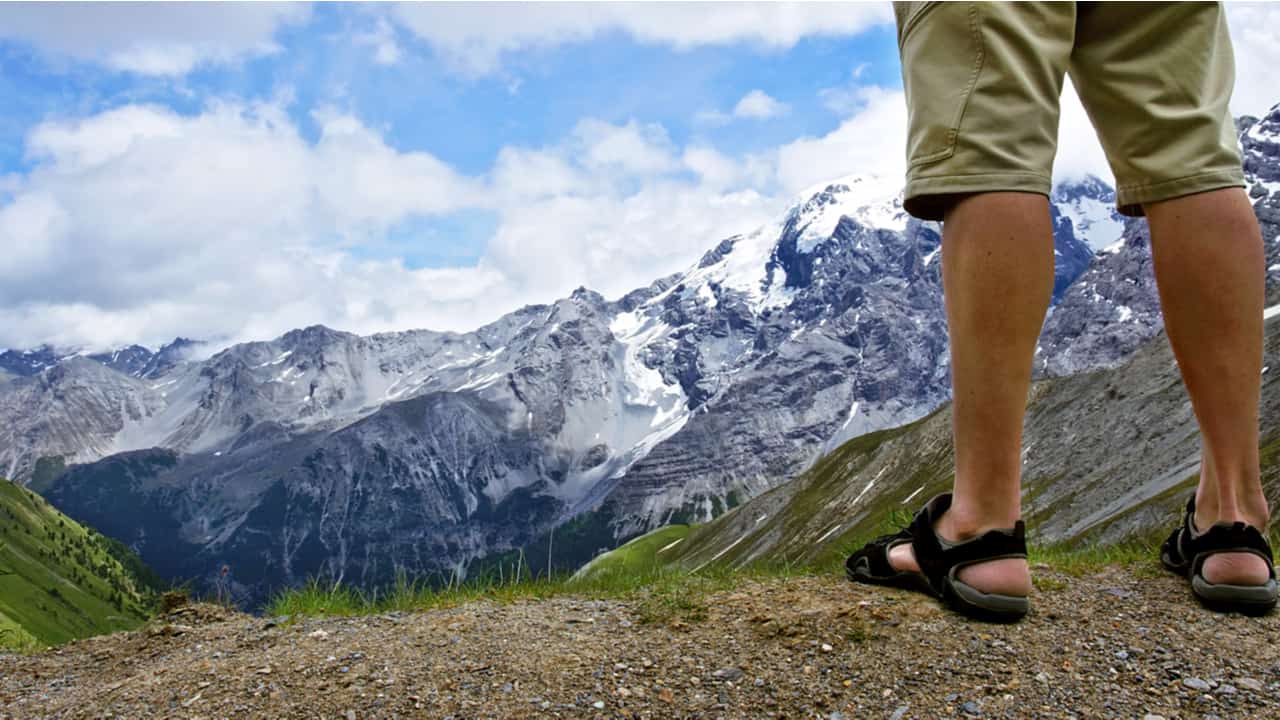 Male hiker wears sandals
