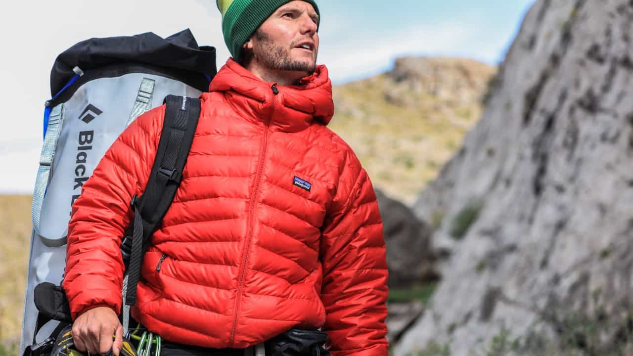 Man wears a red Patagonia jacket