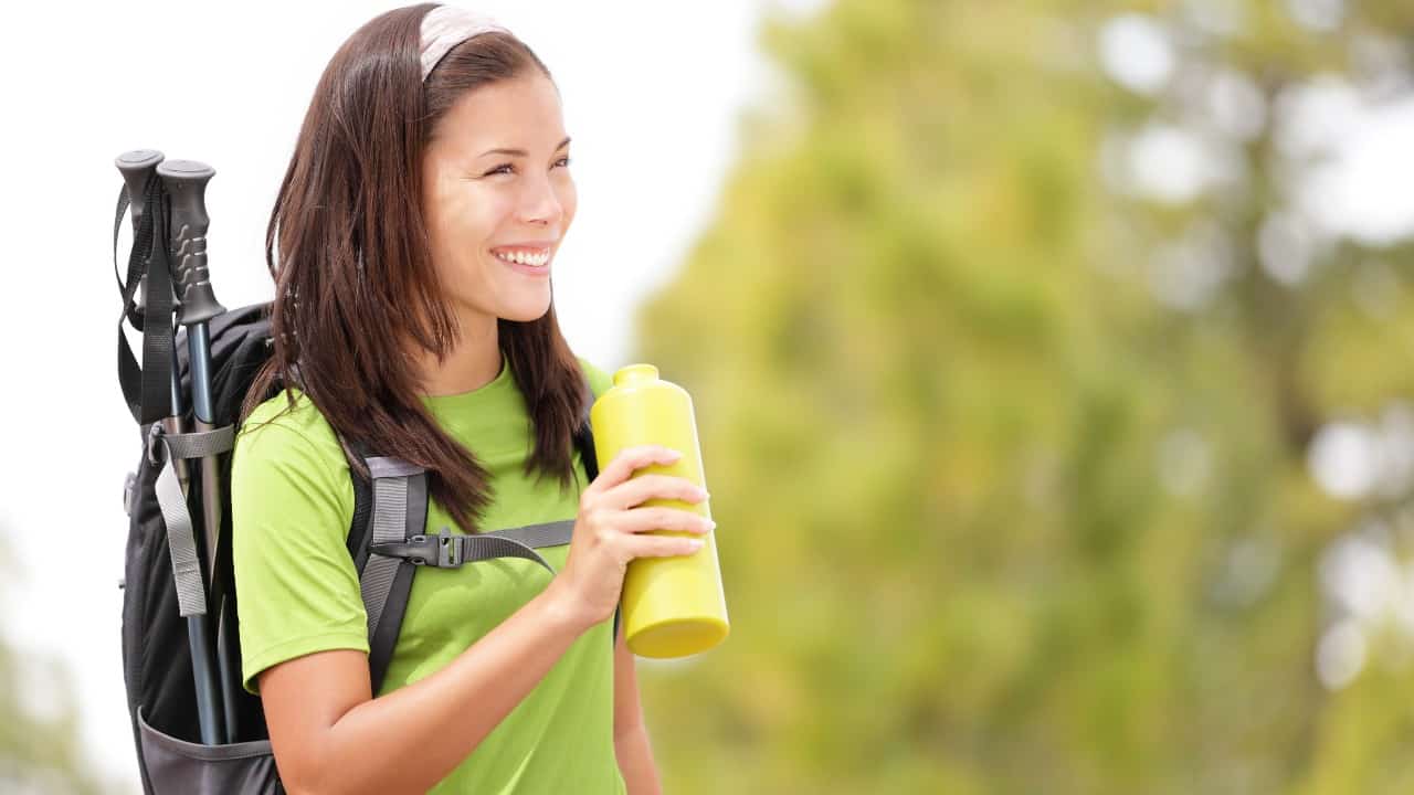 Female hiker with a water bottle