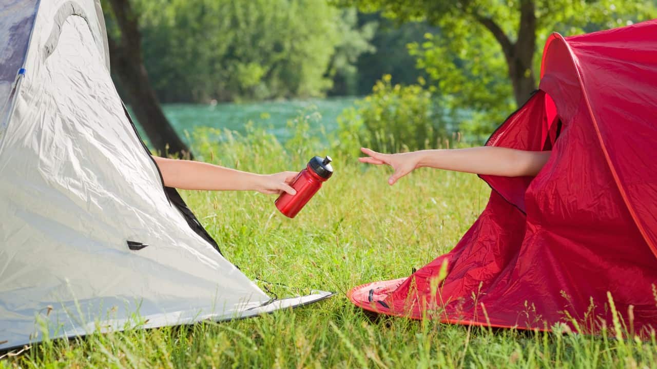 Women sharing a water bottle