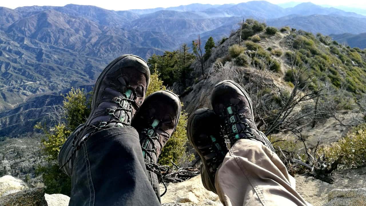 Two people wearing hiking shoes