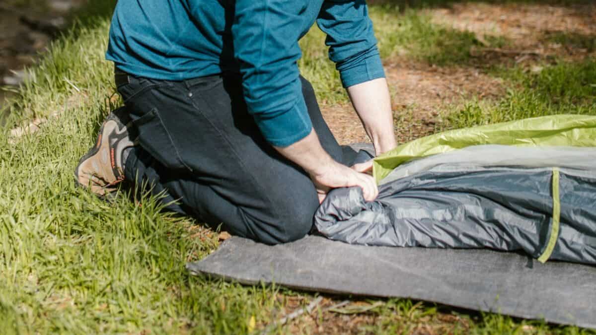 Man packing a tent