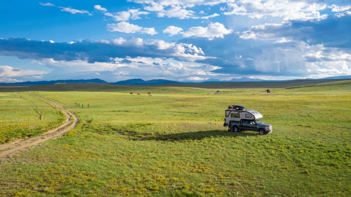 RV Camper in a beautiful green field in Colorado