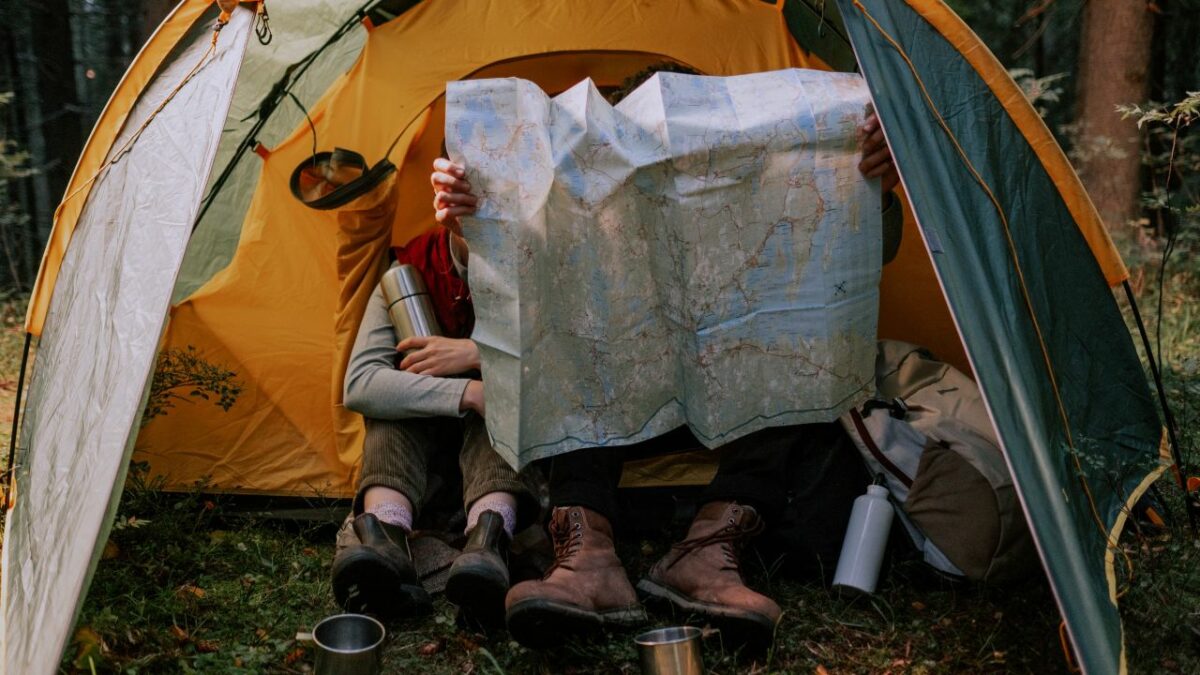 Campers holding a map