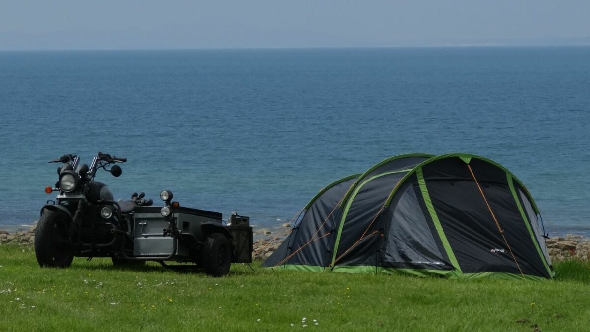 A motorcycle and a tent in Wales