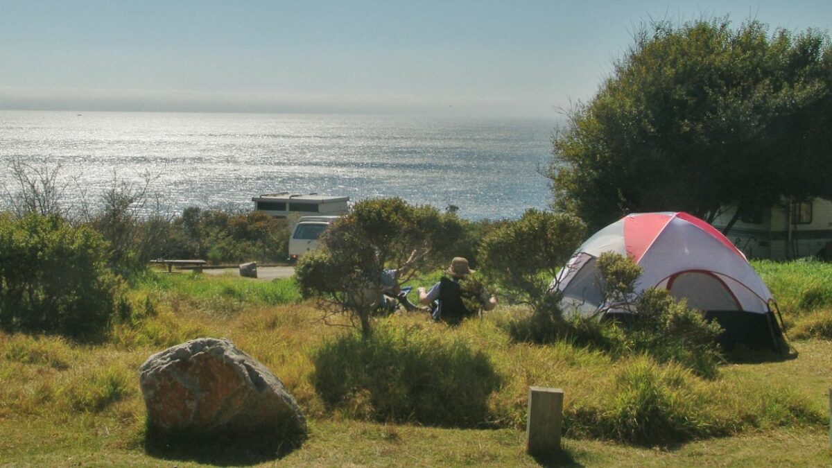 A camper and a tent at a campground near Big Sur