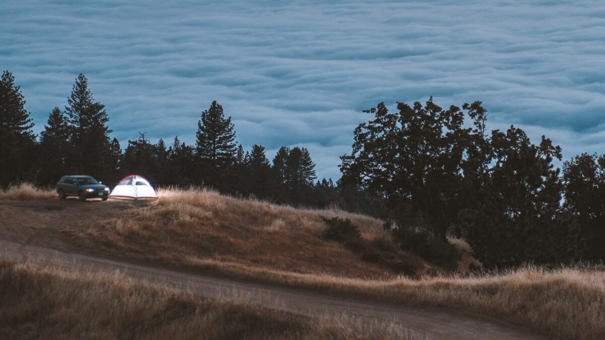 A tent and a car at a dispersed camping spot near Big Sur
