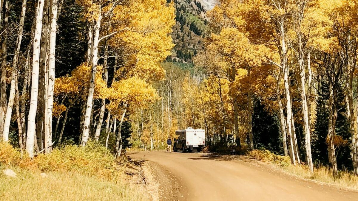 RV on a dirt road near Aspen, Colorado in Fall