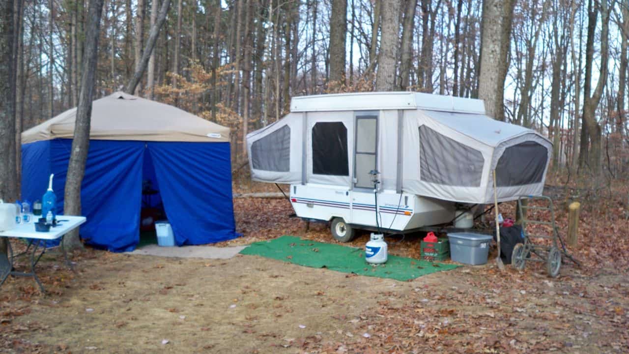 RV and blue tent at a dispersed campground in Hoosier National Forest in fall