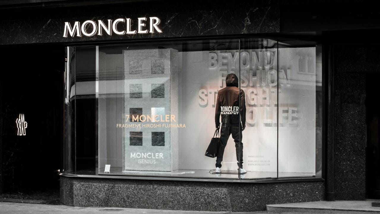 A photo of a Moncler store on the street