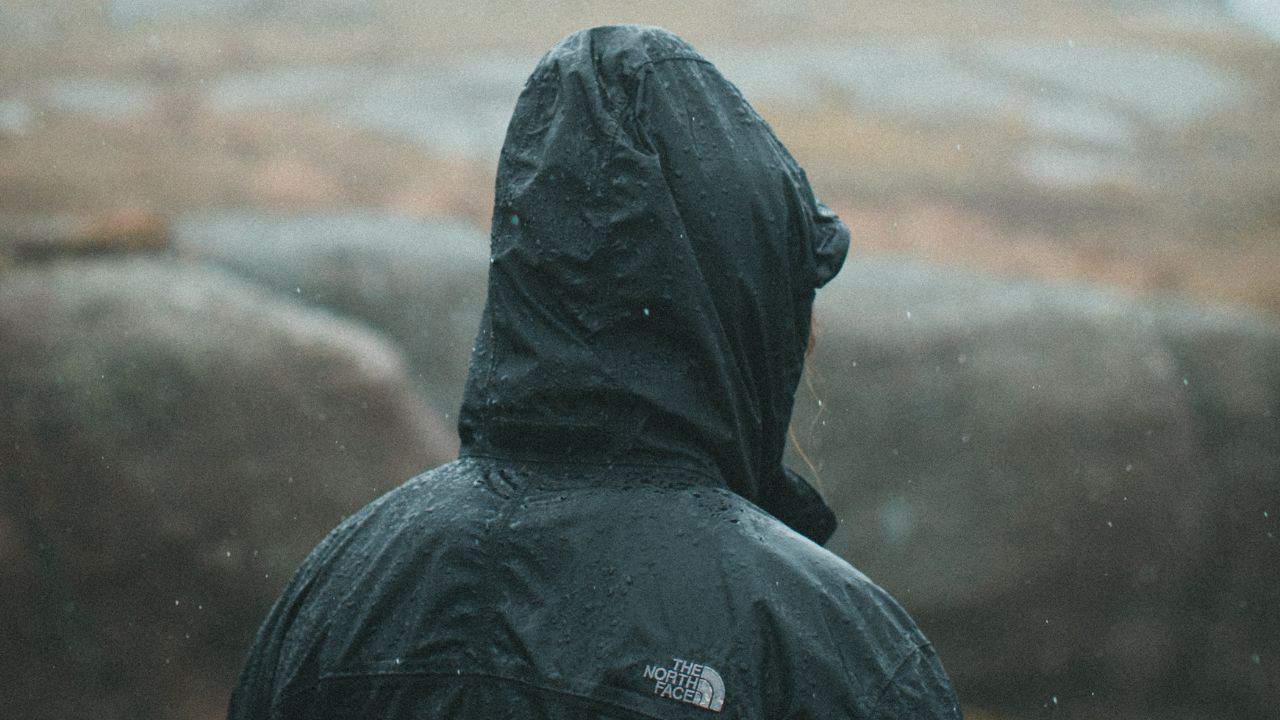 Camper wearing a waterproof jacket