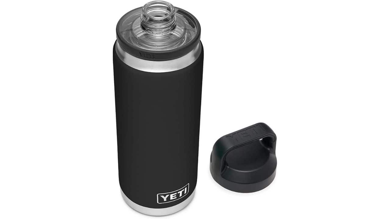 A black Yeti water bottle and with its cap next to it 