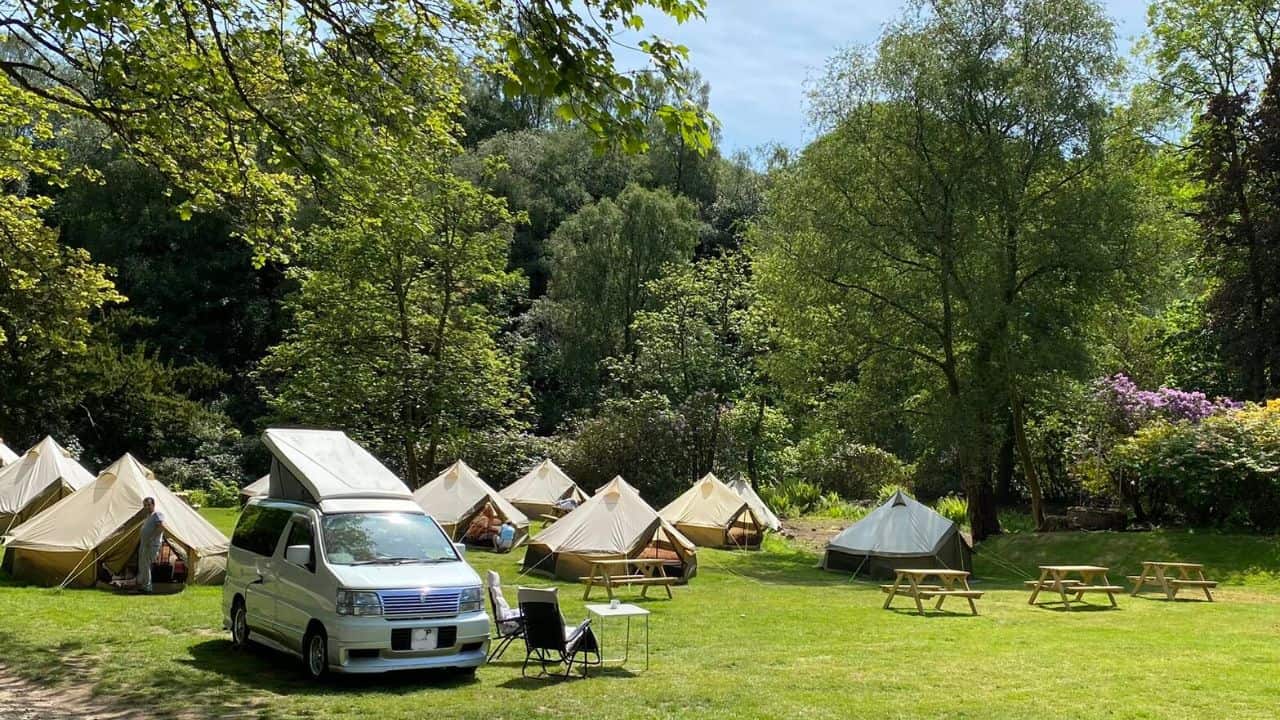 Bell tents and a car at the West Highland Way Campsite