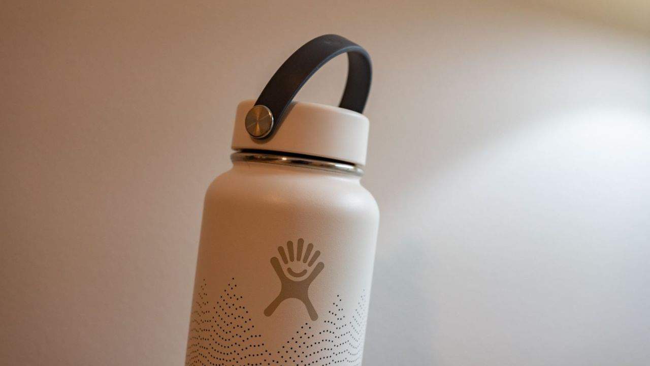 A closeup photo of a white Hydro Flask bottle