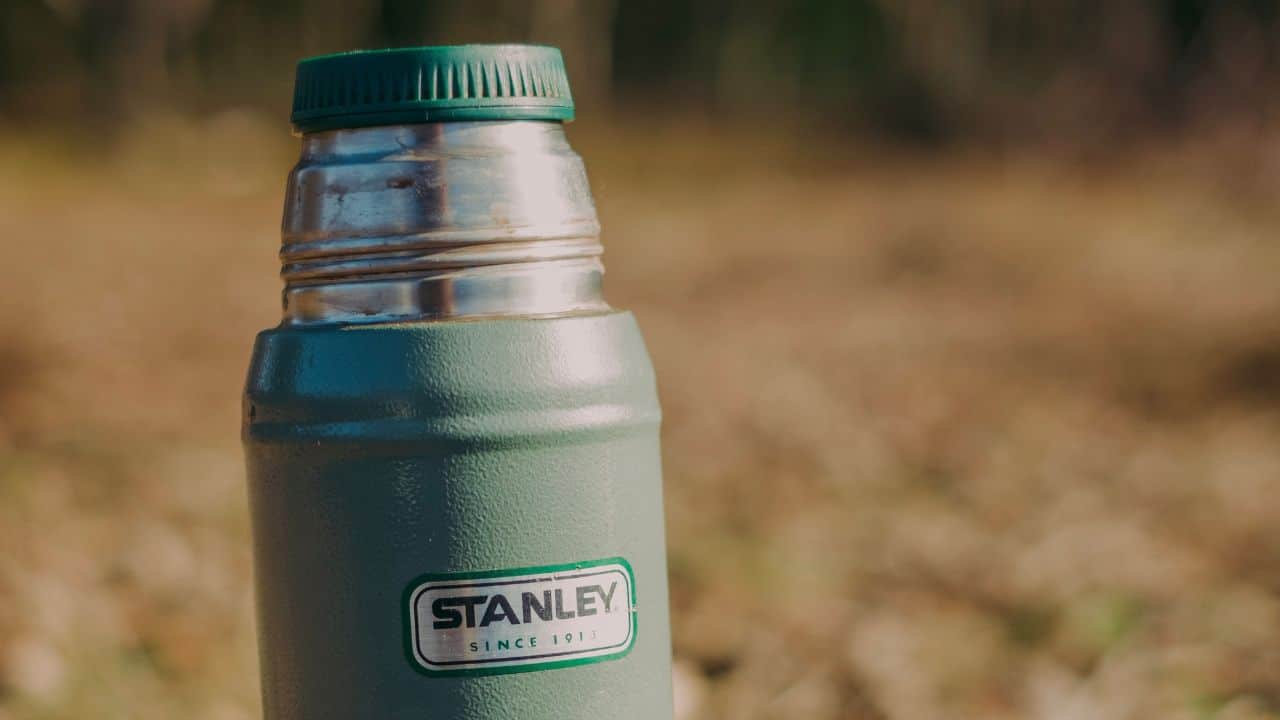 Closeup photo of a green Stanley water bottle