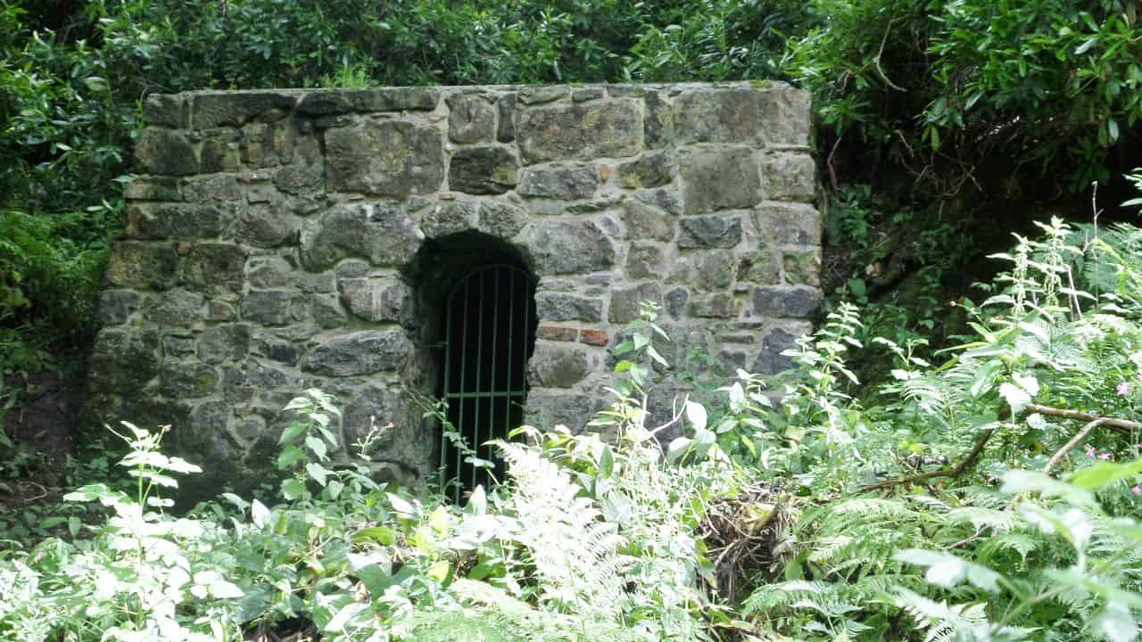 Restored stone entrance in the forest of Clyde Muirshiel Regional Park