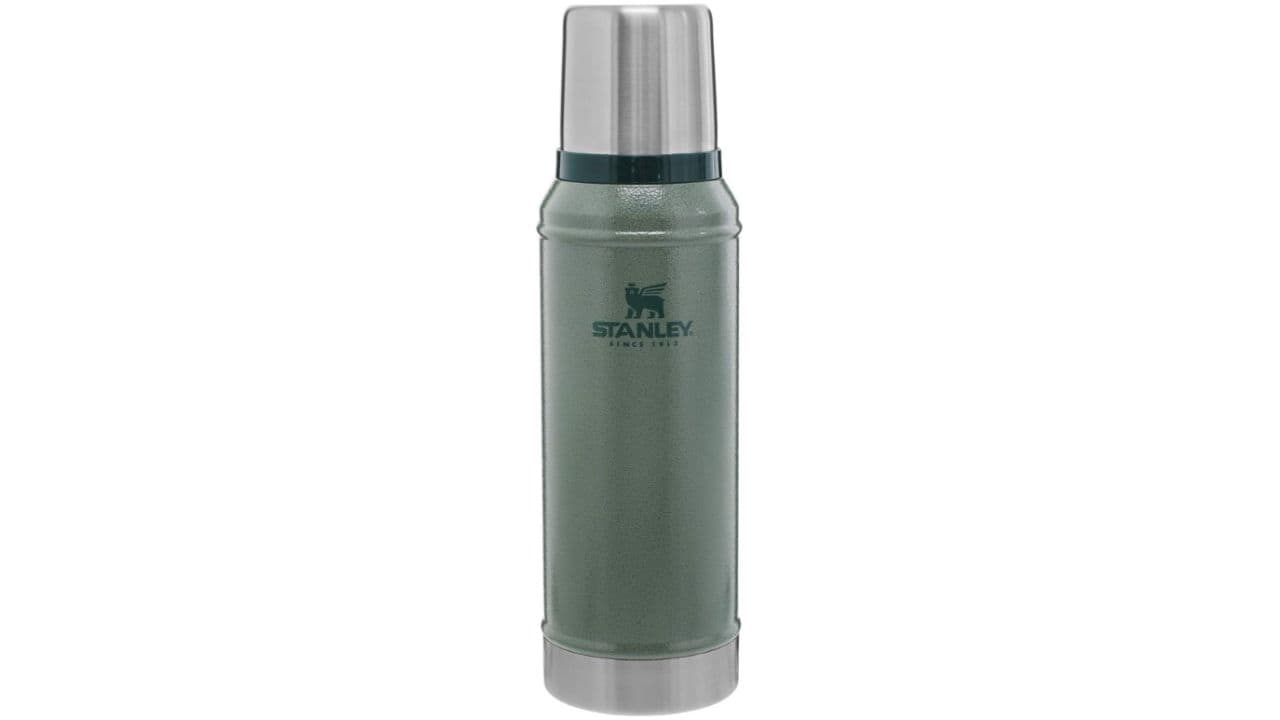 Silver and green reusable Stanley water bottle