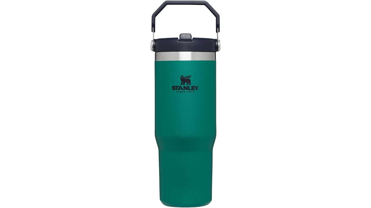 Reusable teal-colored Stanley water bottle with a handle
